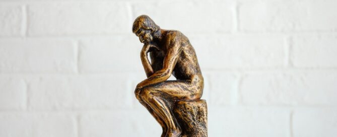 brown concrete statue of man