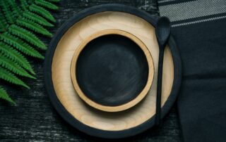 brown and black wooden bowl and plate