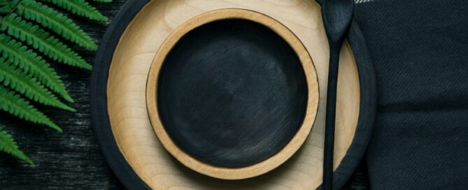brown and black wooden bowl and plate