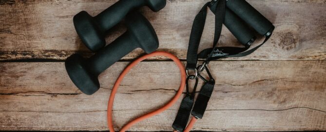 orange and black usb cable on brown wooden surface