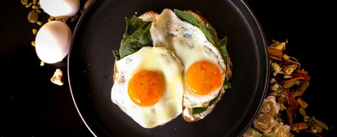 sunny side up egg on black ceramic plate