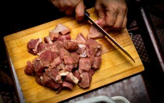 sliced meat on brown wooden chopping board