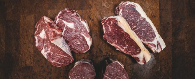 sliced meat beside silver knife